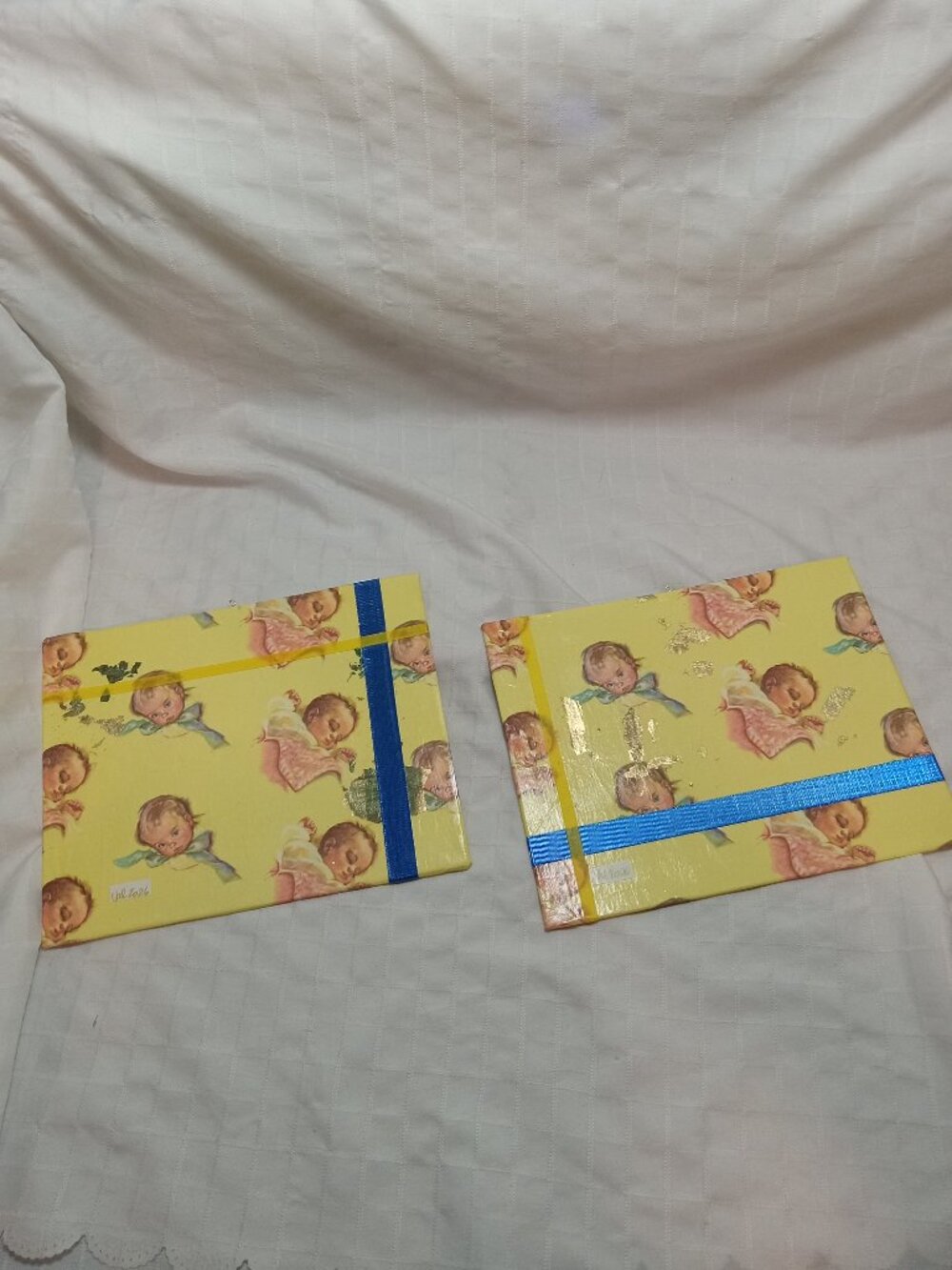 A set of handmade canvas for a baby's room, made of thin vintage wrapping paper